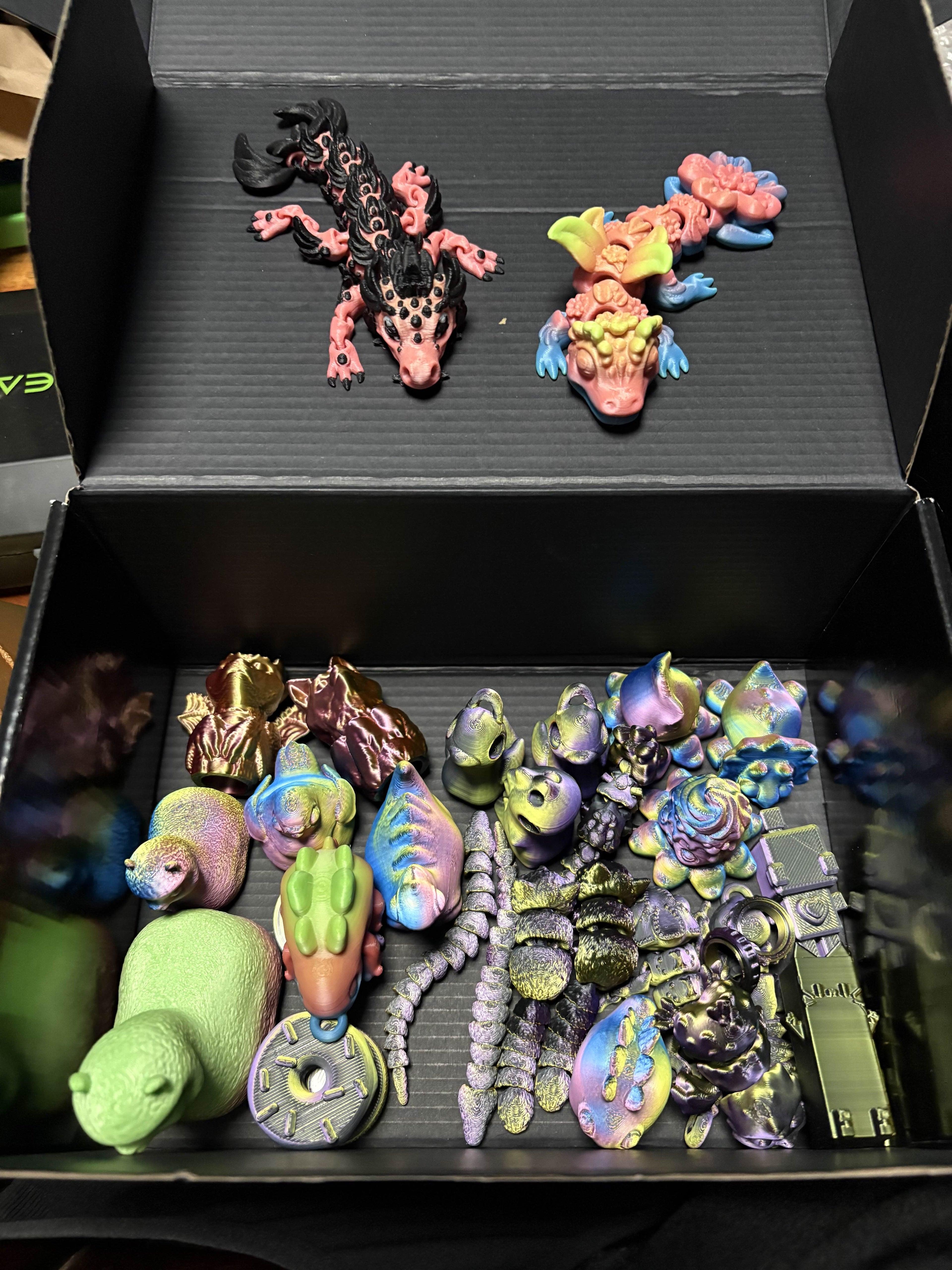 Colorful toy figurines in a black box